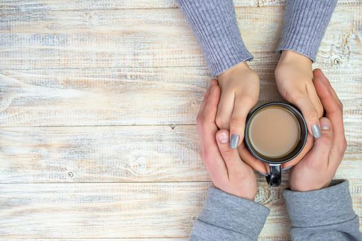 Concept of male and female hands, love and coffee