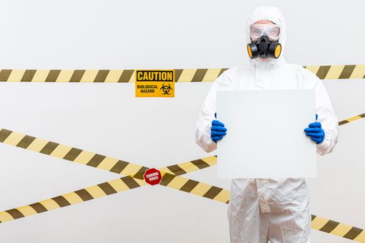 man hazmat suit with blank sign