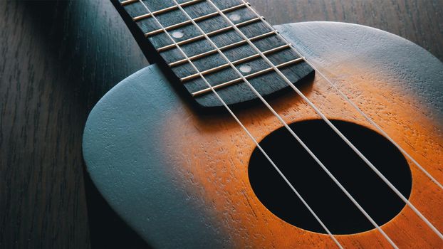 Close-up shot of a sunburst wooden ukulele