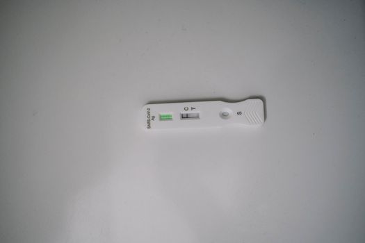 Sars Cov 2 antigen rapid test nasal kit with negative result. self test test at home. corona, covid-19 on white background