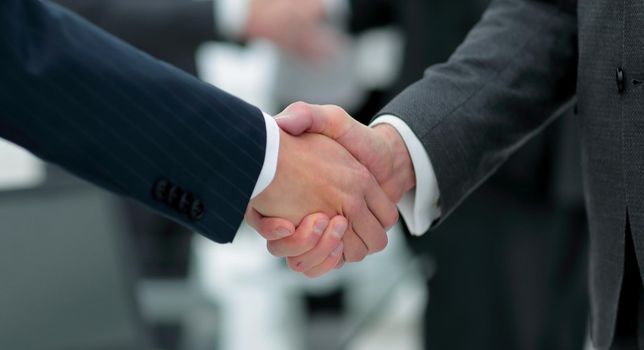 concept of cooperation.handshake of business partners.