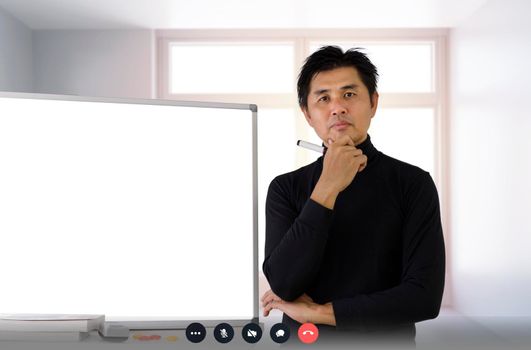 business, education concept. businessman or teacher hold whiteboard marker stand with empty white board. video conference screen businessman meeting with team. Covid-19 learn, work from home 