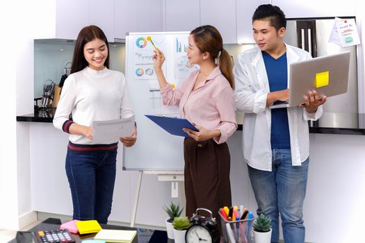 Business Team brainstorm meeting. Group of business people working at Private Home Office.Young business people working with laptop .Asian teamwork business people share idea with team at office