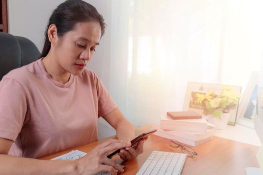 Asian women use smart phone chat with friend. Female use internet connection with smartphone for online shopping. communication concept.