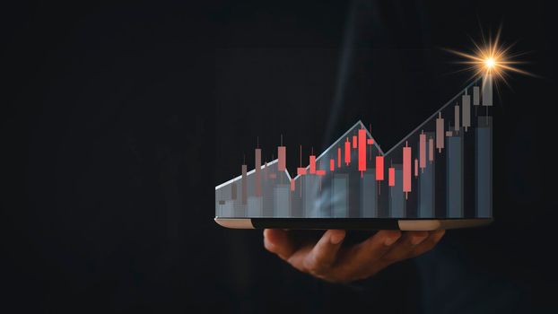stock market growth up. Businessman holds tablet and displays holographic graph showing statistics of profitable graphs. Ideas of growth planning and business strategies to see trends in good business