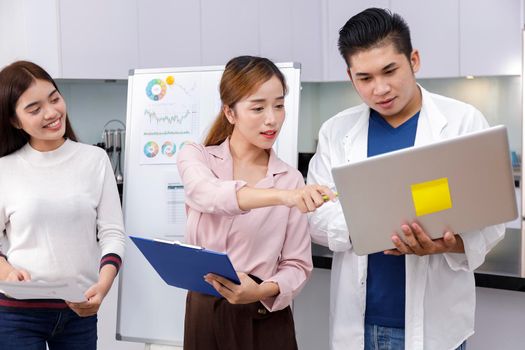 Business Team brainstorm meeting. Group of business people working at Private Home Office.Young business people working with laptop .Asian teamwork business people share idea with team at office