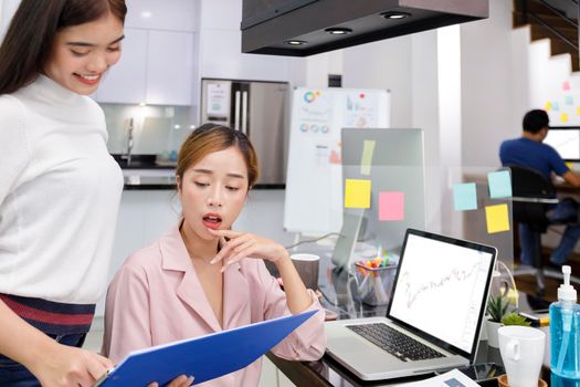 Asian Business Team brainstorm meeting. Business start up working at Private Home Office. New generation business people working New business development, Startup concept.