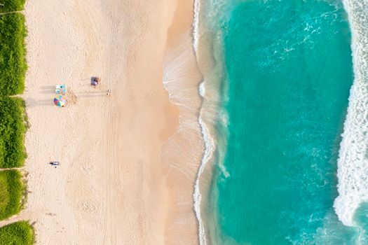 Aerial drone top view crowd of happy people relax at tropical Beach with sunset in Phuket, Thailand, Beautiful Phuket beach is famous tourist destination at Andaman sea. Holiday summer concept