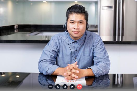 Screen of businessman talking with video call, video conference meeting at home. Business people working at home with online video call looking at camera