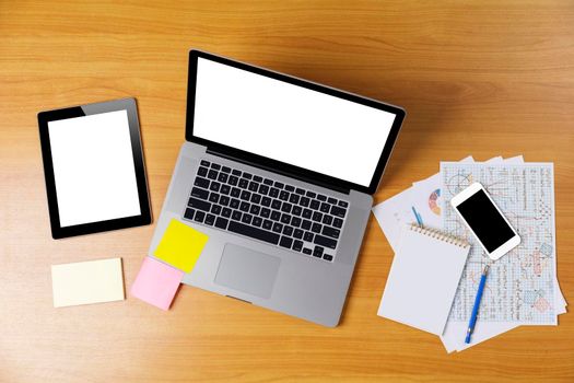 Laptop or notebook, mobilephone or smartphone, tablet with blank white screen on wood table white background save with clipping path. Laptop with empty screen for text or design.