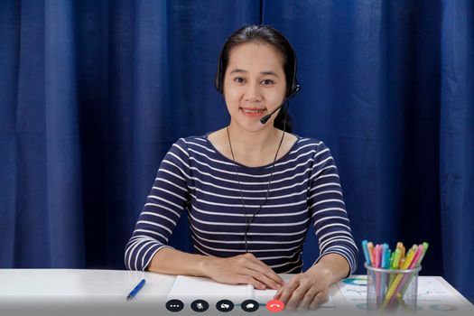 Screen of businesswoman talking with video call, video conference meeting at home. Business people working at home with online video call looking at camera