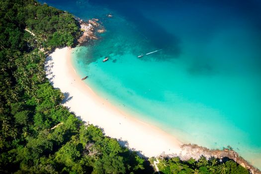 Aerial drone top view crowd of happy people relax at tropical Beach with sunset in Phuket, Thailand, Beautiful Phuket beach is famous tourist destination at Andaman sea. Holiday summer concept