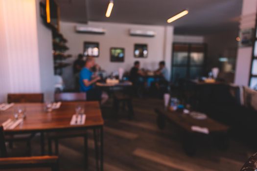 Blur coffee shop or cafe restaurant with abstract light image background. For montage product display or design. Blur coffee shop process in vintage style