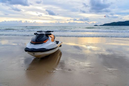 Jet ski or water scooter parking on the Beach at evening time with sunset background.