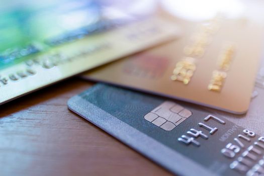 Close up of credit card soft focus and selective focus for background. soft focus close up credit card on wood table background