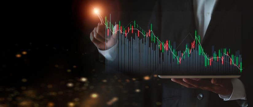 stock market growth up. Businessman holds tablet and displays holographic graph showing statistics of profitable graphs. Ideas of growth planning and business strategies to see trends in good business
