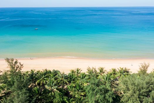 Aerial drone top down view crowd of people at tropical Beach with sunset in Phuket, Thailand, Beautiful Phuket beach is famous tourist destination at Andaman sea. Top view happy people play on the beach