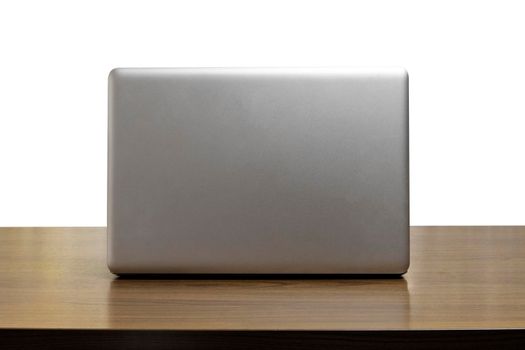 Back side laptop or notebook on wood table white background. back side laptop with copy space for text or design.