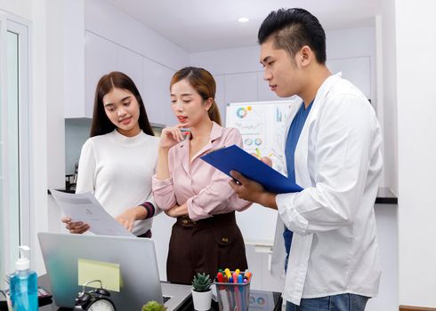 Business Team brainstorm meeting. Group of business people working at Private Home Office.Young business people working with laptop .Asian teamwork business people share idea with team at office