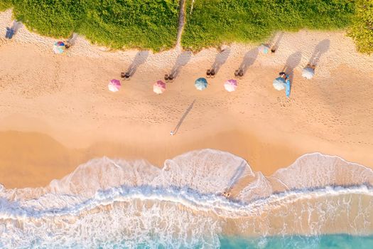 Aerial drone top view crowd of happy people relax at tropical Beach with sunset in Phuket, Thailand, Beautiful Phuket beach is famous tourist destination at Andaman sea. Holiday summer concept