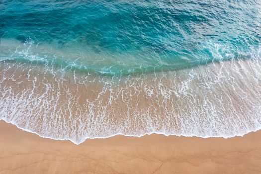 Abstract of beautiful soft wave come to beach background. Soft wave of blue sea on sand beach background.