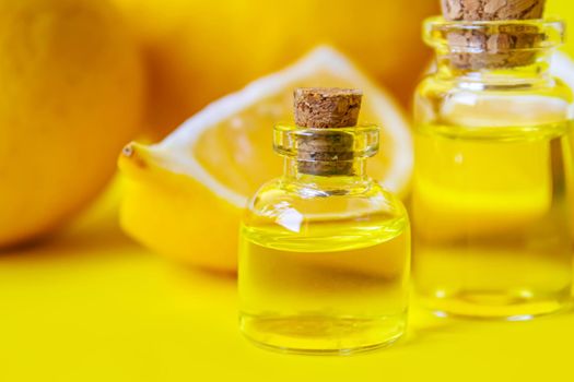 lemon essential oil on a yellow background. Selective focus.nature