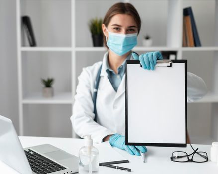 doctor holding medical clipboard