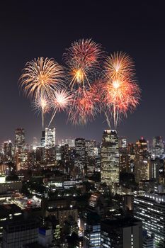 Fireworks celebrating over Tokyo cityscape at night of Japan