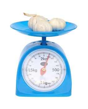 kitchen scales and garlic isolated on white background (with clipping path)