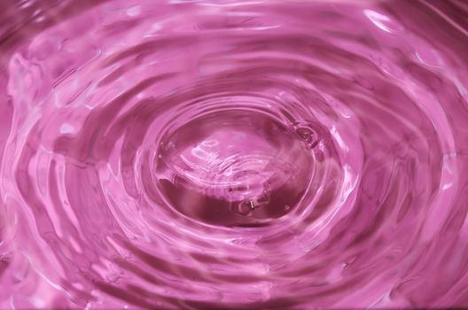 Close-up macro of a wave from water drop droplet