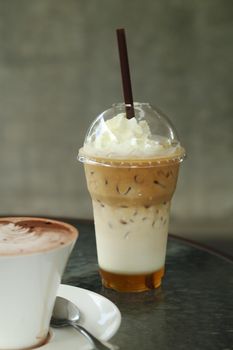 ice coffee with whipping cream in cafe
