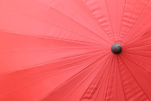 Close up top view texture of red umbrella