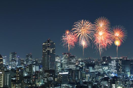 Fireworks celebrating over Tokyo cityscape at night of Japan