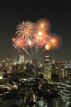 Fireworks celebrating over Tokyo cityscape at night of Japan