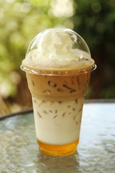 ice coffee with whipping cream in cafe