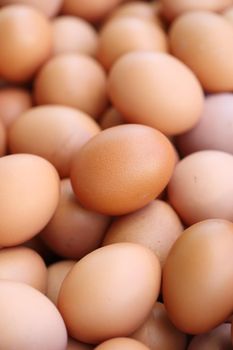 many fresh brown eggs for sale at a market