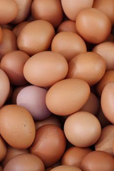 many fresh brown eggs for sale at a market