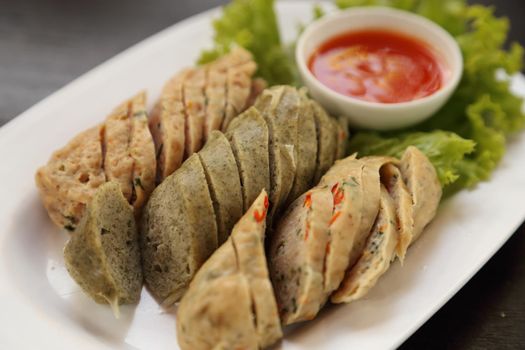 ''Mooyor'' or Vietnamese sausage pork with sauce on a plate