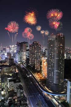 Fireworks celebrating over Tokyo cityscape at night of Japan