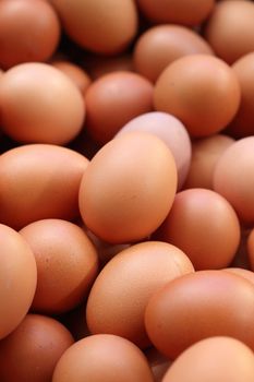 many fresh brown eggs for sale at a market