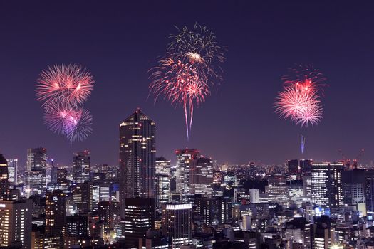 Fireworks celebrating over Tokyo cityscape at night of Japan