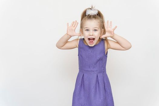 portrait of a little girl with a shocked expression. Wow offer concept.