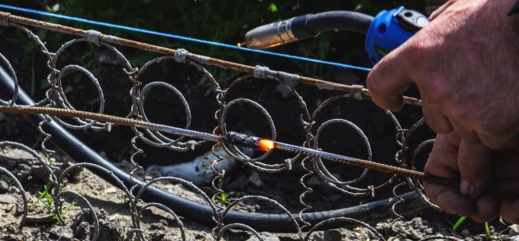 Welder Welding Steel Bars Rebar, Selective Focus