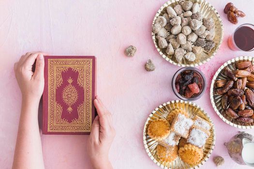 hands with koran sweets