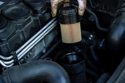 replacing the oil filter on the car. Selective focus