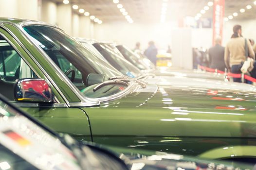 View of many vintage cars in a exhibition with sunlight