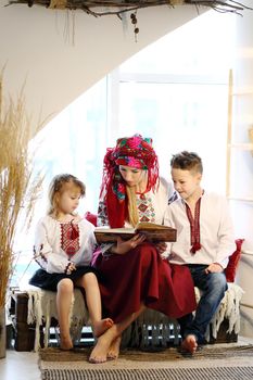 Ukraininan family wearing ethnic style embroidered shirt, modern derivative from traditional Ukrainian vyshyvanka.