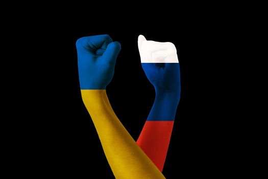 Raised hands flags of Ukraine and russia. Stop war. Putin invasion