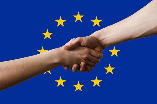 Ukraine and European union EU shaking hands each others on EU blue flag with stars background