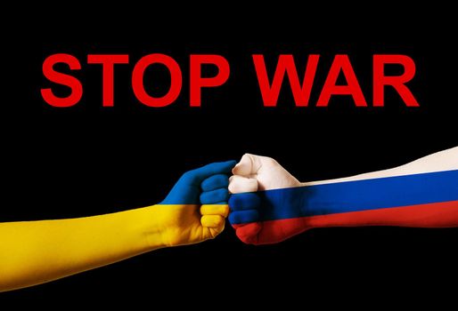 Fist fight flags of Ukraine and russia with text stop war on black background. Putin invasion
